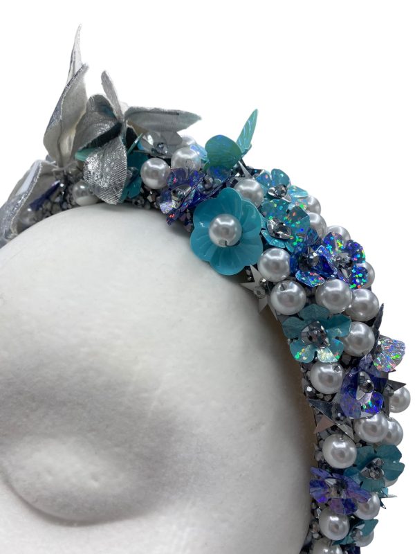 Blue and turquoise crown with silver leaf detail.